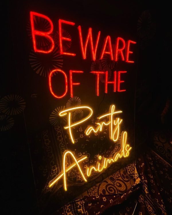 beware of the party animals neon sign